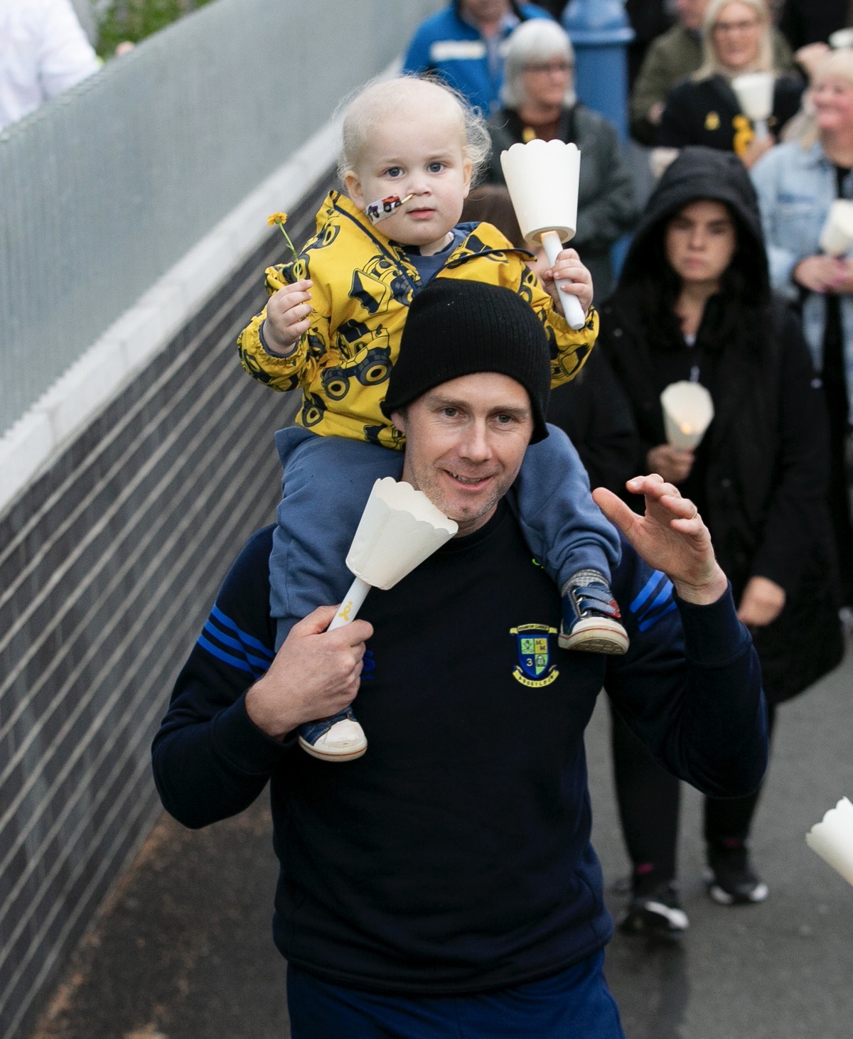 *****NO FEE PIC***
24/09/2023
Stephen Reilly with son Jude Reilly 2 all from Naas
during the Light it up Gold Walk in Maynooth, Co. Kildare.
The candlelit walk brought families and the community together in solidarity, to shine a light on living with and beyond childhood cancer. 
The event took place in St. Patrick’s College Maynooth & St. Mary's Boys' National School marking  the 10th anniversary of the first walk in Dublin in 2013.
PHOTO: Gareth Chaney/Collins