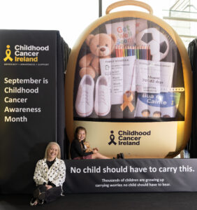 Photo of the school bag installation with Ruby Shannon and her mum Yvonne.